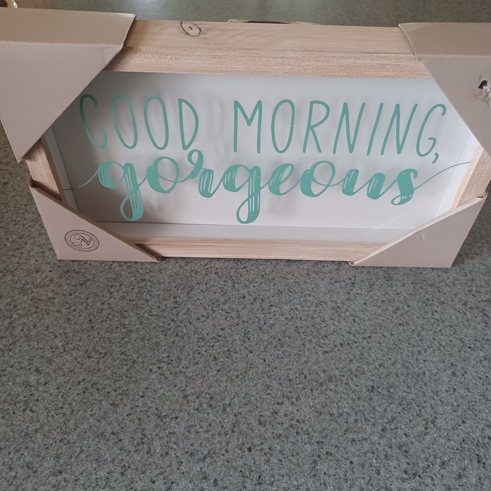Wooden Sign with Teal Text
